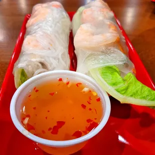 a plate of food with dipping sauce