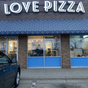 a car parked in front of the restaurant