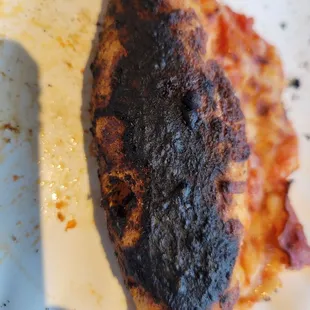 Crust was burned. Not the kind of burned that tastes good that you can still eat. It was unedible.