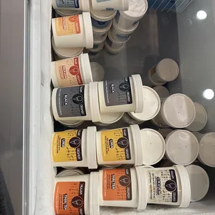 a refrigerator filled with containers of food