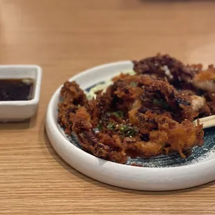 Suppose to be fried calamari tentacles but looks like fried squid. Nothing like the picture on the menu.