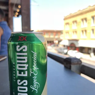 a can of beer sitting on a table