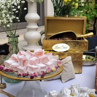 a table of sweets and flowers