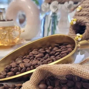 coffee beans in gold bowls