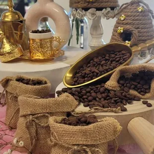 a table with coffee beans and coffee beans