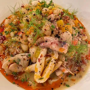 a plate of food with meat and vegetables