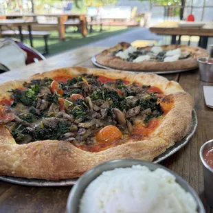 Veggie Pizza (side of ricotta) in the foreground; Cacio e Pepe in the back