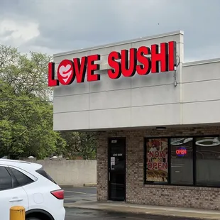 a car parked in front of a restaurant