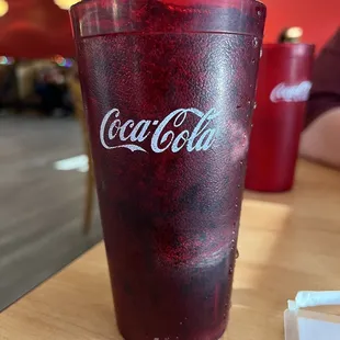 a coke glass on a table