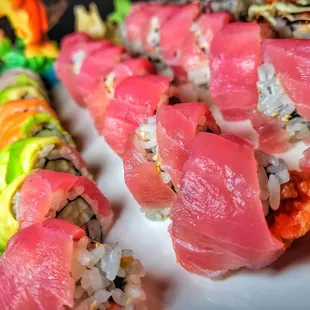 a plate of sushi rolls