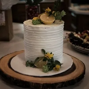 a white cake with lemons on top