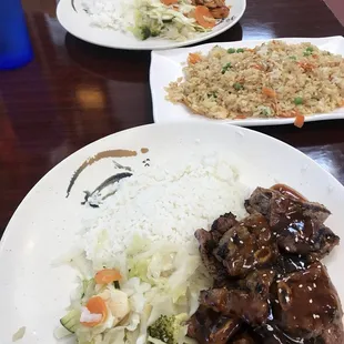 hot &amp; spicy chicken and short ribs plates with a side of fried rice