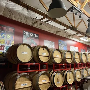 a wall full of wine barrels