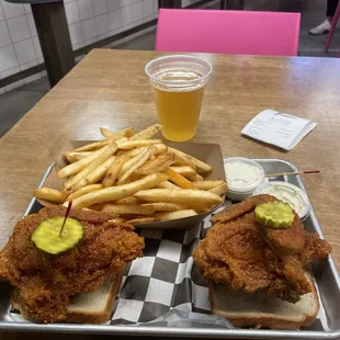 Fried chicken, fries, beer and lots of hot sauce.