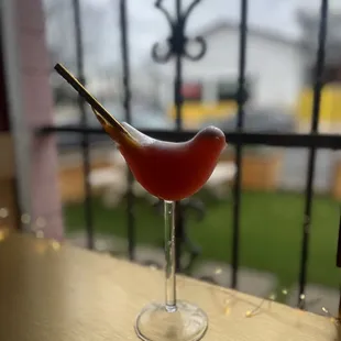 a glass of wine on a table