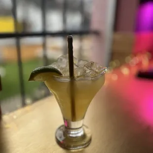 a margarita in a glass on a table