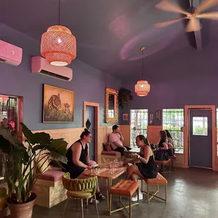 a group of people sitting in a restaurant