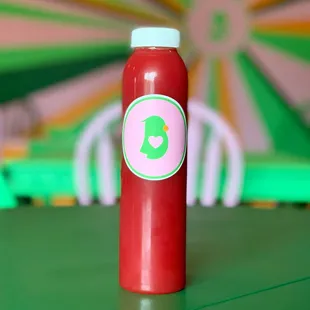 a bottle of ketchup sitting on a table
