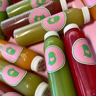 a pile of juices with labels on them