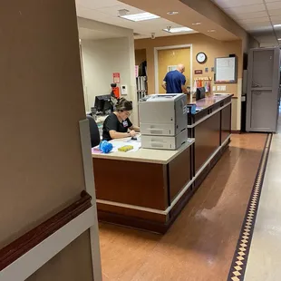 Tech playing on personal phone on floor 2 at hospital.