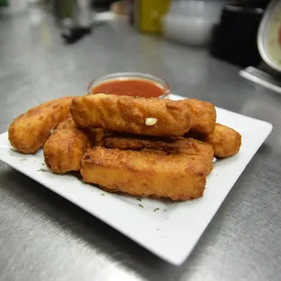 A fresh order of mozzarella sticks on their way to an excited customer