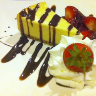 the new York cheesecake with chocolate sauce and fresh strawberries. Only available seasonally