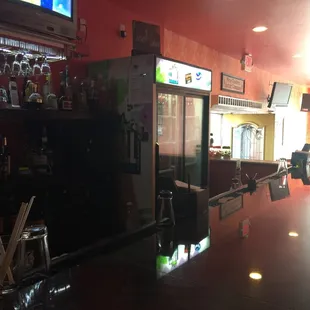 Bar area while we wait for carry-out. Friendly service.  Good drinks.