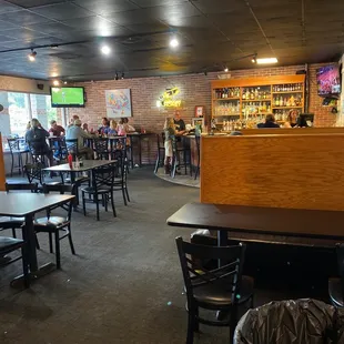 people sitting at tables in a restaurant