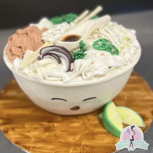 a bowl of noodles with chopsticks