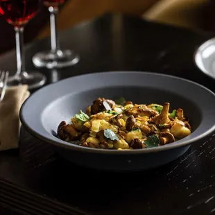 a plate of food and a glass of wine