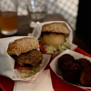 two burgers and a side of fried chicken
