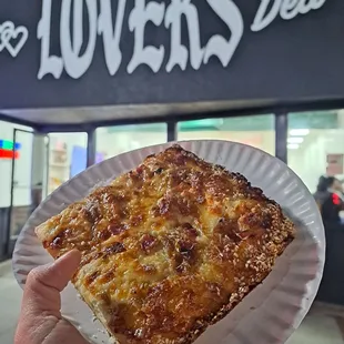 Frank White-- sesame seed crust, ricotta, bacon, caramelized onions, ricotta, shaved parm.