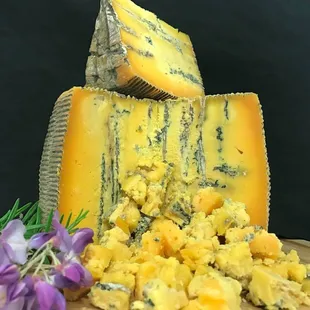 Bleu Thunder!  A rustic Gorgonzola made from Raw Jersey cow milk and aged to perfection. The flavor is buttery with a creamy texture.