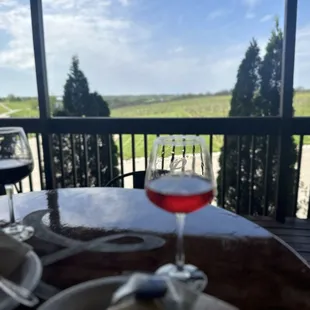A glass of the rose overlooking the vineyards.