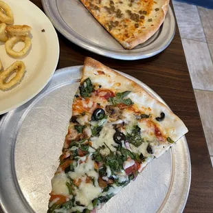 a slice of pizza and fries