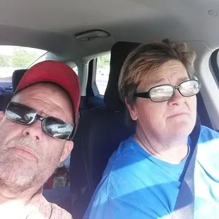 a man and a woman in a car