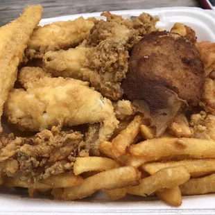 Seafood Platter Meal with flounder, perch, oysters, shrimp, scallops, deviled crab, hushpuppies, fries and slaw