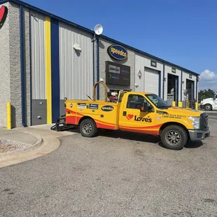 a truck parked in front of a building