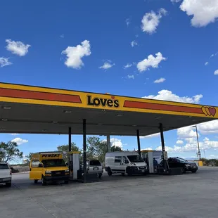 two trucks at a gas station