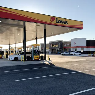 a car parked in front of a love's gas station