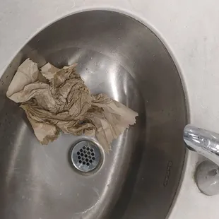 a dirty sink in a bathroom