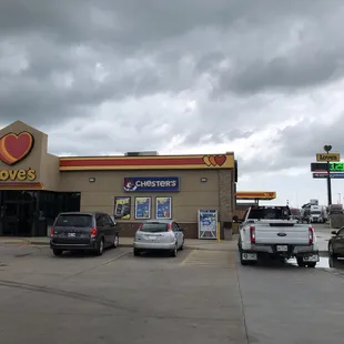 Another view of the storefront and the big gasoline sign.