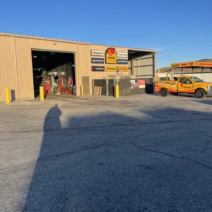 a yellow car parked in front of a building