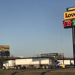 a truck and a gas station