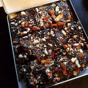 a tray of chocolate covered with nuts
