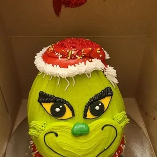 Grinch cake with smashed hat... didn't fit properly in any of their boxes.