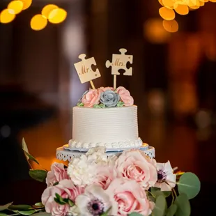 a wedding cake decorated with flowers