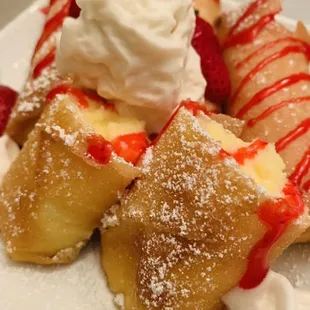 Fried Cheesecake w/strawberry drizzle and fresh strawberries