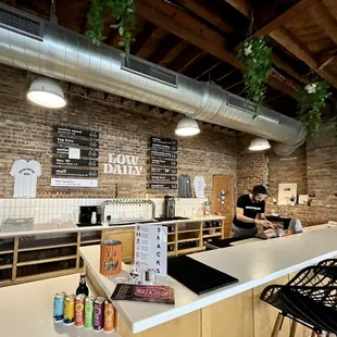 a man sitting at a counter in a coffee shop