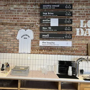 a brick wall with a menu on it